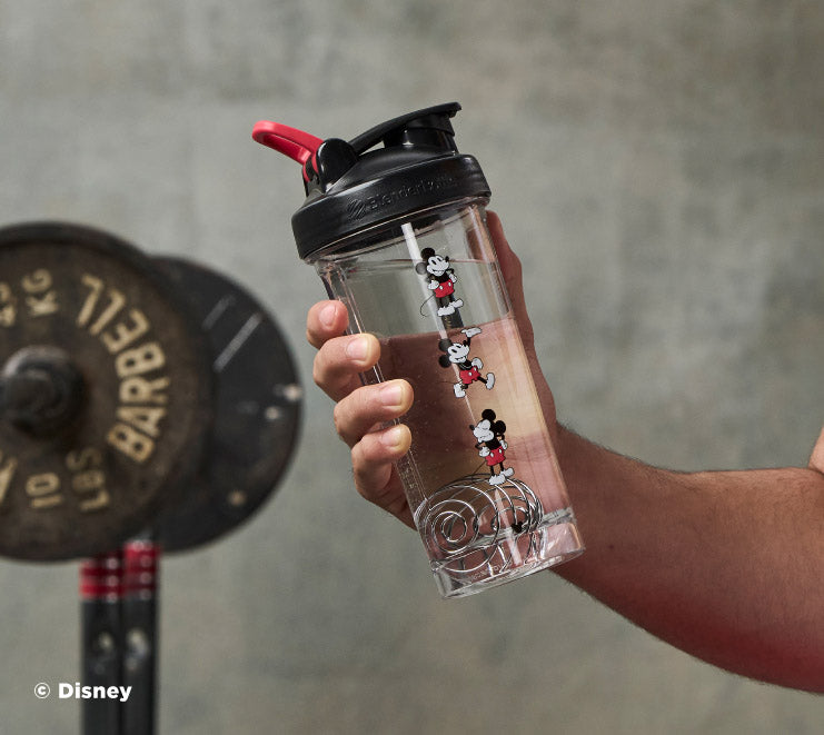 pro-series-n2 Mickey_Mouse_Protein_Shaker_Bottle_Being_Held_In_the_Gym.jpg